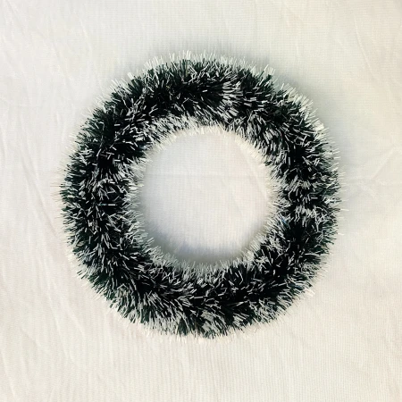 A dark green garland with white edges A dark green garland with white edges